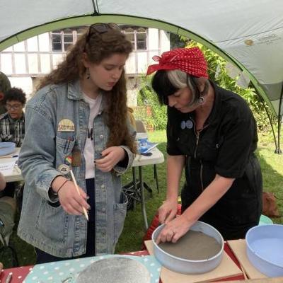 People sculpting with clay