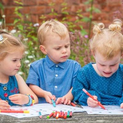 young children colouring in pictures